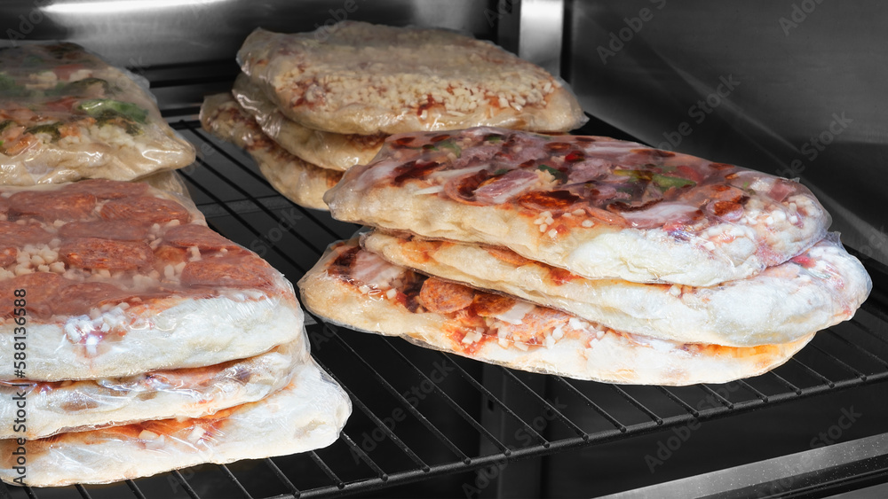 Pizza blanks in the refrigerator in a pizzeria Pizza blanks in the refrigerator in a pizzeria