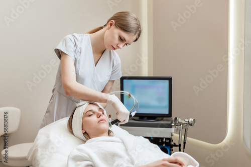 Face Skin Care. Woman Getting Facial Hydro Microdermabrasion Peeling Treatment