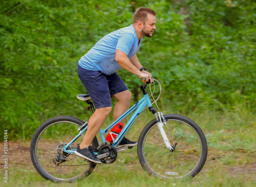 man riding a bike in the forest