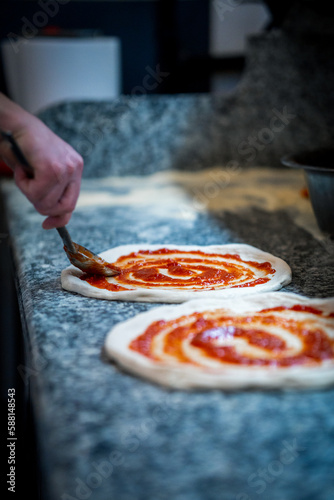 Pizza Napoletana Italian Pizza in the making by cook 