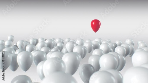 Standing out from the crowd. Red Baloon flying over the other white ballons. Outstanding red baloon from white baloons