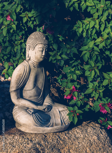 Zen Buddha in Garden on Rock
