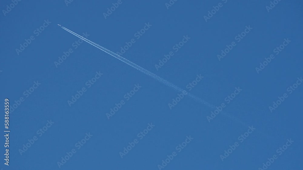 jet with contrail in springtime blue sky jet with contrail in springtime blue sky