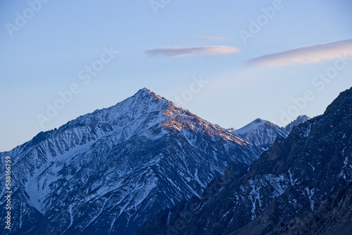 The sun sets on the towering Sierra Nevada Mountains, seen from the sparsely populated Eastern Sierra region of California