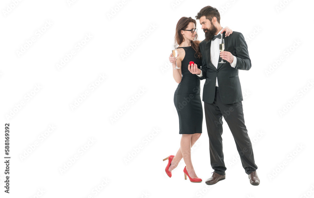 Let the love last forever. couple drink champagne for union conclusion. happy family. formal couple celebrate engagement party. making marriage proposal. tuxedo man present jewel ring in box to woman Let the love last forever. couple drink champagne for union conclusion. happy family. formal couple celebrate engagement party. making marriage proposal. tuxedo man present jewel ring in box to woman