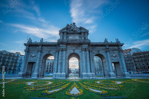 The Alcala Gate is a neoclassical monument located in the Plaza de la Independencia square in Madrid, the capital of Spain. photo