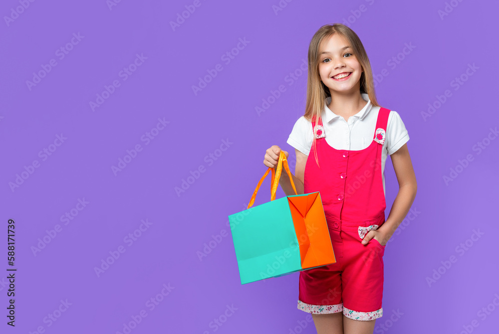 photo of teen girl at shopping sale, advertisement. teen girl at shopping sale isolated on purple. photo of teen girl at shopping sale, advertisement. teen girl at shopping sale isolated on purple.