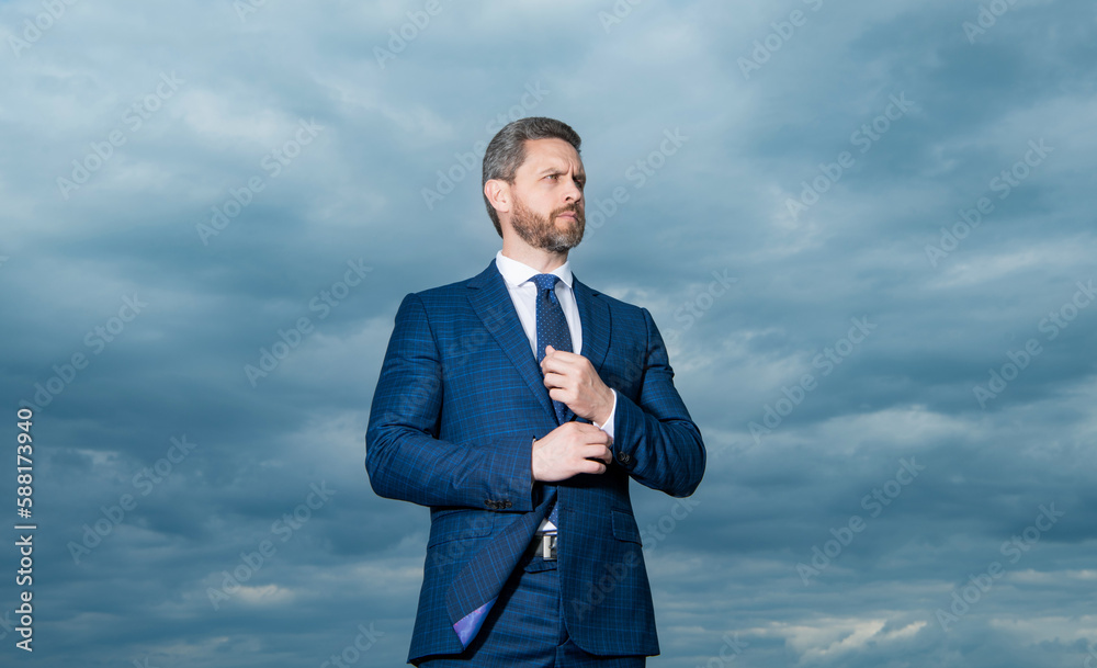 caucasian man in business suit. photo of man in suit. man in suit on sky background. man in suit caucasian man in business suit. photo of man in suit. man in suit on sky background. man in suit