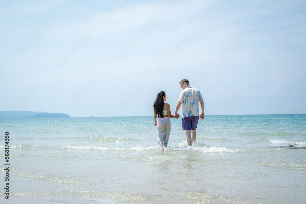 Fun,Holiday,Couple happy on vacation having fun by the sea.