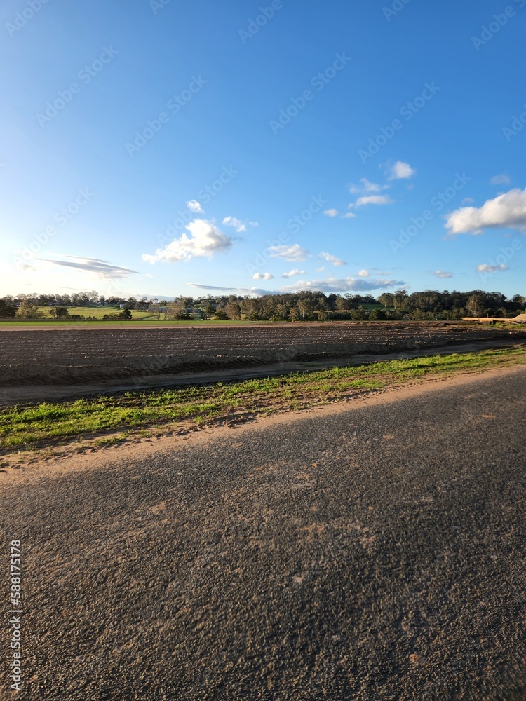 a road in a sheep farming area in Australia.