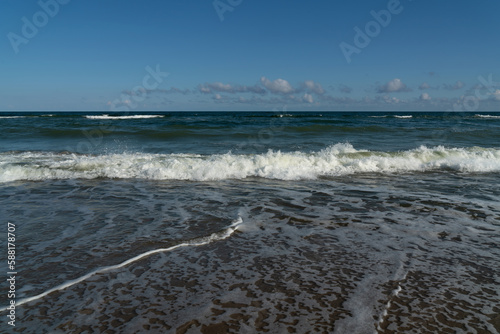 Fototapeta Naklejka Na Ścianę i Meble -  View of the incoming wave on the Baltic Sea on the shore of the Curonian Spit on a summer day, Kaliningrad region, Russia