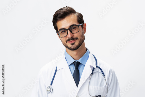Male smile doctor in a white coat and eyeglasses and a stethoscope looks at the camera on a white isolated background, copy space, space for text, health © SHOTPRIME STUDIO