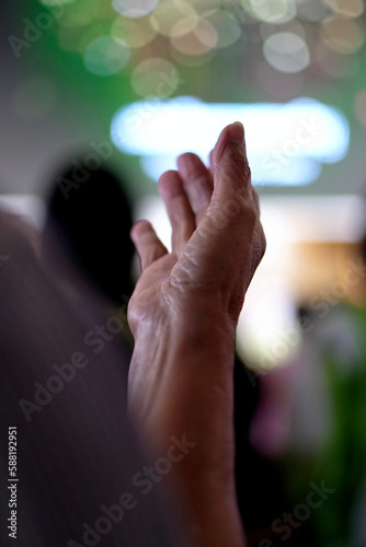 selective focus, Hand raising in Church.