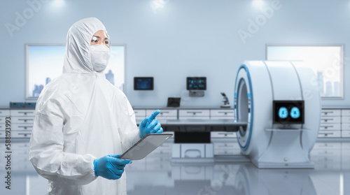 Foto Doctor wears medical protective suit or coverall suit with x-ray brain and mri s