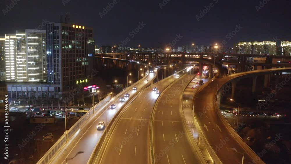 Aerial photography of urban roads and buildings at night,Vehicles traveling on the road at night Aerial photography of urban roads and buildings at night,Vehicles traveling on the road at night
