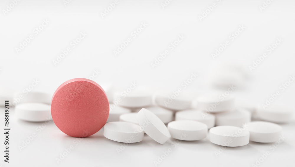 Red and white pills on white background. Heap of assorted various medicine tablets and pills. Red and white pills on white background. Heap of assorted various medicine tablets and pills.