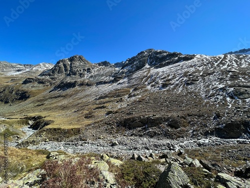 Mountain stream Aua da Grialetsch in the beautiful autumn setting of the alpine valley Val Grialetsch of the Albula Alps massif, Zernez - Canton of Grisons, Switzerland (Kanton Graubünden, Schweiz)