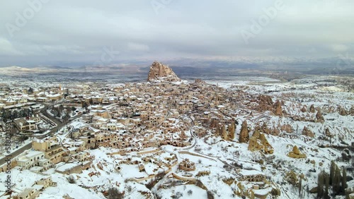 Aerial 4K drone footage of Uchisar, Uchisar castle and Pigeon Valley also known as Guvercinlik Valley in Cappadocia, Turkey. photo