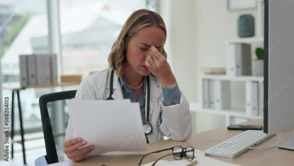 Asian woman, doctor and reading document with headache in burnout, stress or strain at office desk. Tired medical female professional suffering from head pain, fatigue or healthcare report at clinic