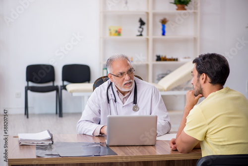 Young male patient visiting old male doctor