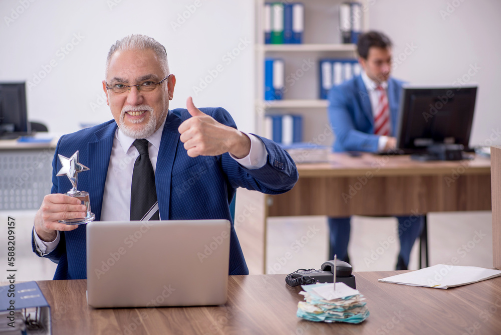 Two male colleagues in employee of the month concept Two male colleagues in employee of the month concept