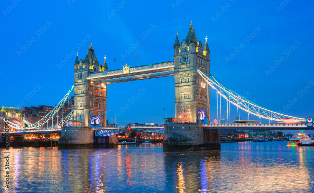 Panorama of the Tower Bridge, Tower of London on Thames river at dusk - London, United Kingdom