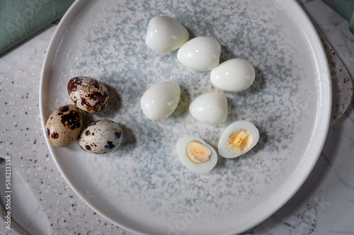 Boiled eggs lying on a plate, on a board. Useful and tasty ingredient.