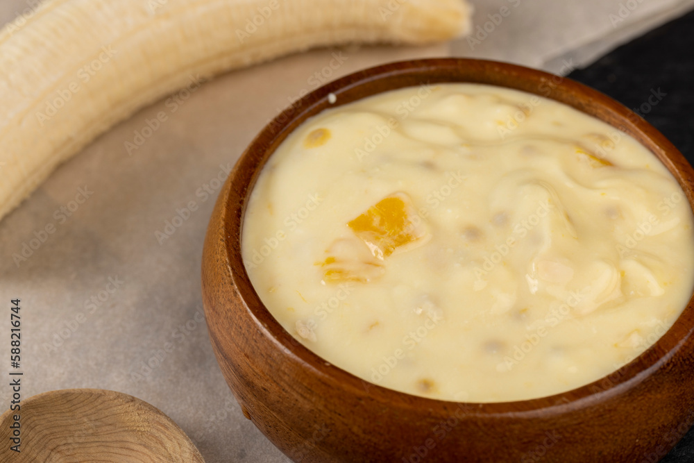 natural yogurt with pieces of fruit and banana flavor natural yogurt with pieces of fruit and banana flavor