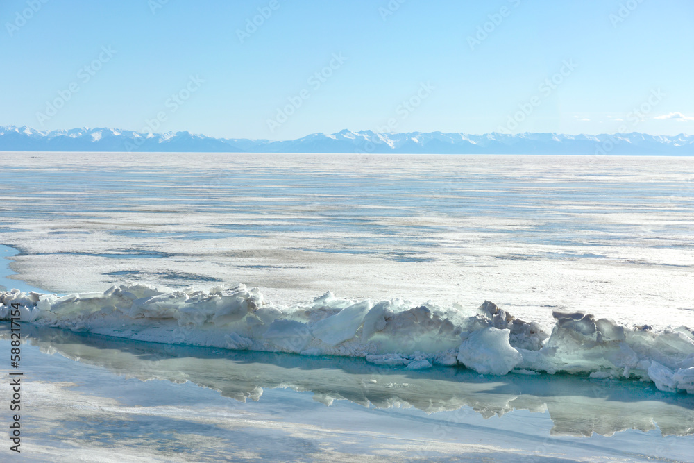 Fototapeta premium Frozen Lake and Snowy Mountains Winter Landscape