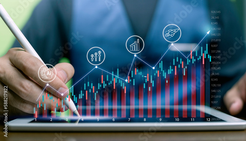 Businessman using artificial intelligence ( A.i ) analysis big data sciences economic growth with financial graph. technology digital marketing investment network.Data graph screen on stock market