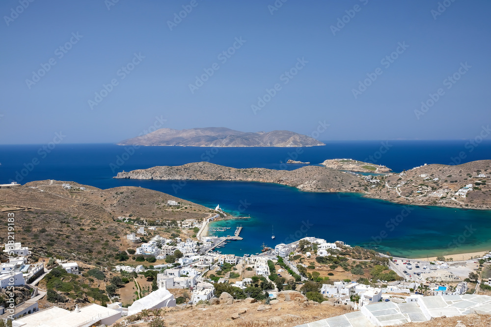 Panoramic view of the beautiful picturesque port of Ios Greece and the island of Sikinos in the background