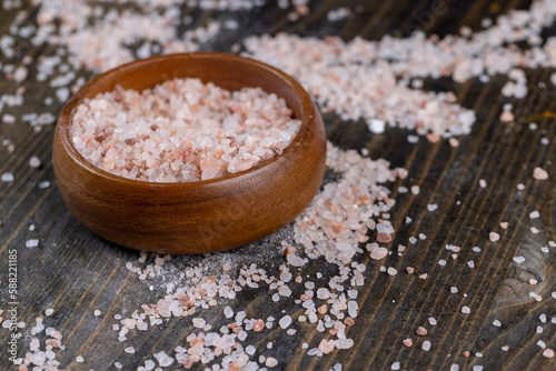 Pink natural salt on the table, close up