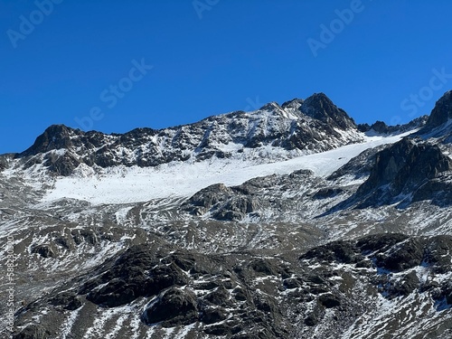 Early autumn remains of the alpine glacier Vardet da Grialetsch in the Albula Alps mountain massif, Zernez - Canton of Grisons, Switzerland (Kanton Graubünden, Schweiz) photo