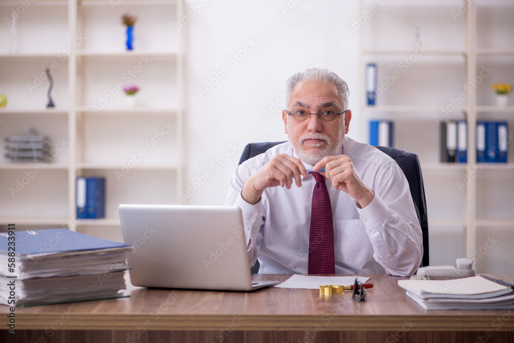 Old male employee and too much work in the office Old male employee and too much work in the office