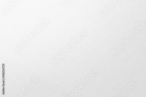 White recycled craft paper texture as background. Grey paper texture cardboard. 