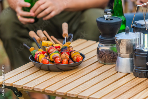 barbeque and coffee equipment on table camping picnic. dinner summer party lifestyle. party weekend.