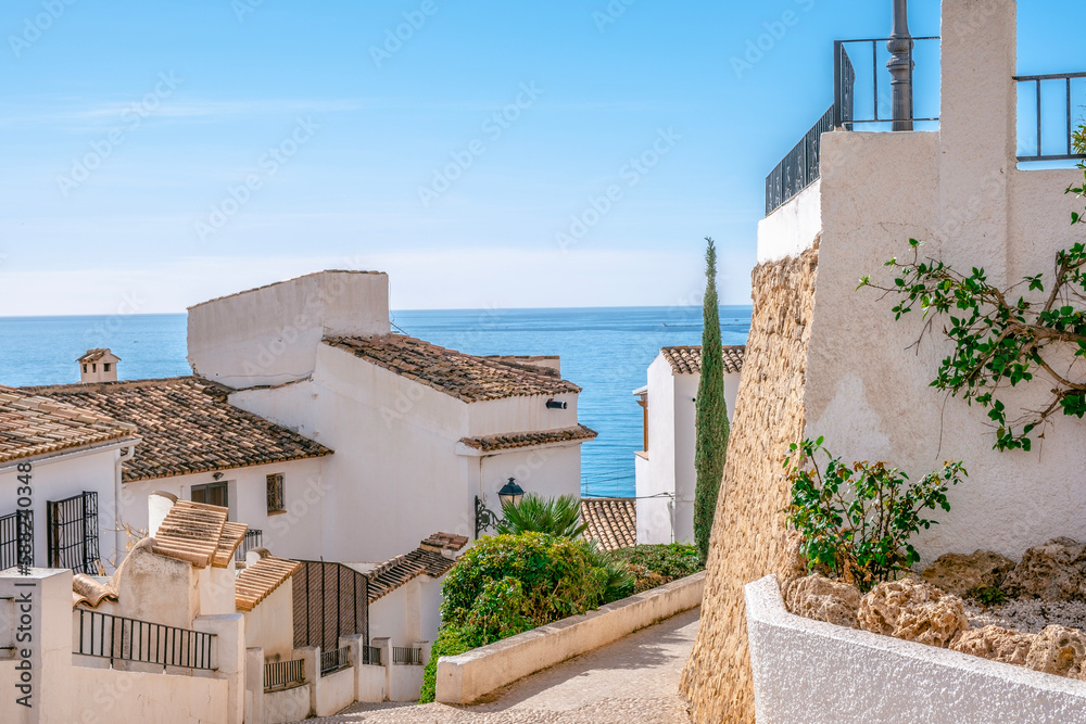 Altea old town with narrow streets and whitewashed houses. Architecture in small picturesque village of Altea near Mediterranean sea, Alicante province, Valencian Community, Spain