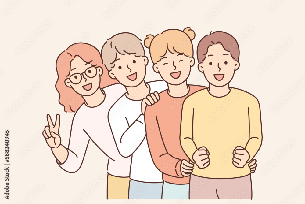 Pre-teenage children stand behind each other and laugh enjoying socializing together Pre-teenage children stand behind each other and laugh enjoying socializing together