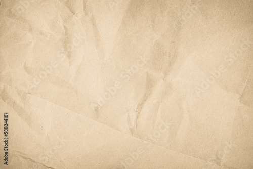 Brown recycled craft paper texture as background. Cream paper texture, Old vintage page or grunge vignette. Pattern rough art creased grunge letter. 