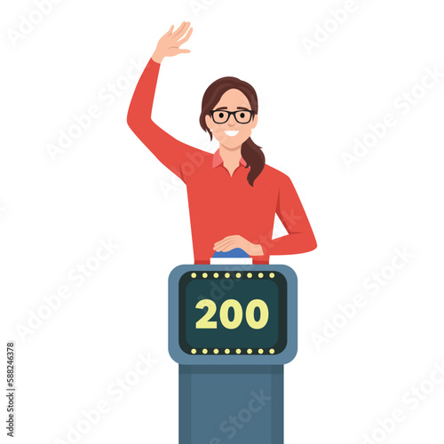 Young woman playing quiz game answering question standing at the stand with button. Girl pressed the buzzer first and raised hand up in the light of spotlight