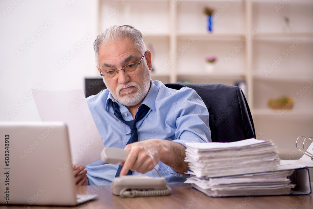 Old male employee and too much work in the office
