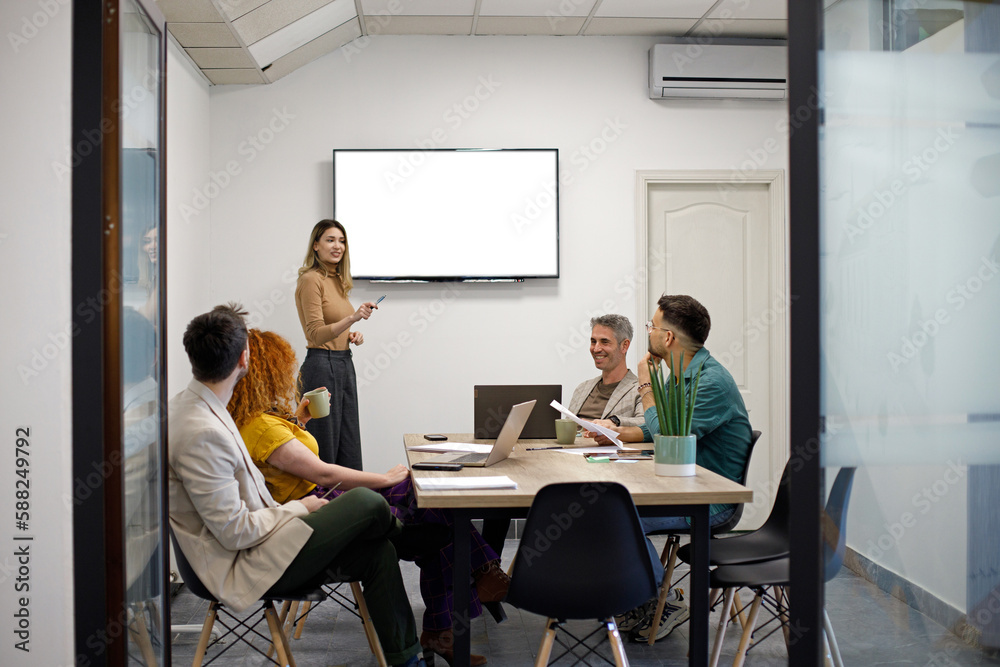 Business team on a morning briefing; business meeting and presentation in a modern office