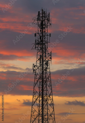 Telephone tower on a twilight sky background.