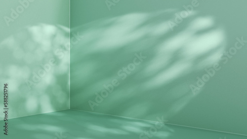 Green summer background for product presentation. Corner of the room. Sunlight and foliage shadows on the wall and floor.