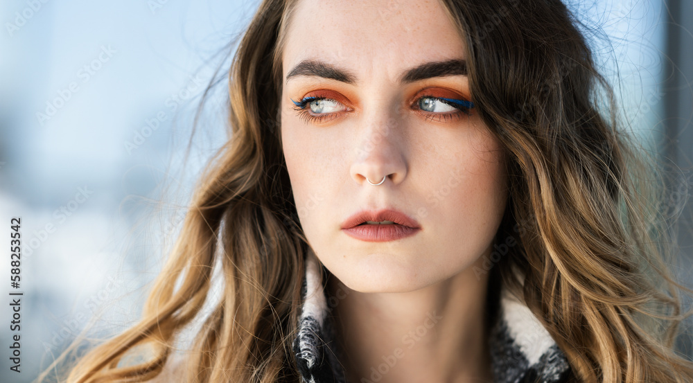 Portrait of young beautiful woman. Natural light. Shallow depth of field.