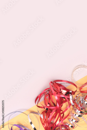 Ribbons on a gray background. Festive composition with place for text. Selective focus.