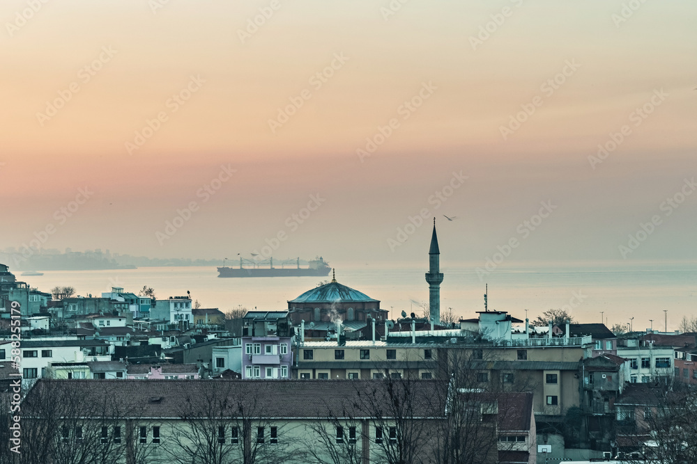 Fatih area of Istanbul, view from the rooftop, old houses in Fatih and Bosphorus view at sunset, Istanbul