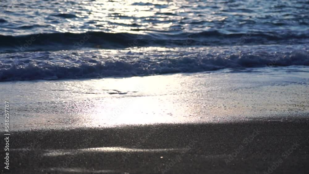 Small sea wave, Blurred Soft foamy waves washing golden sandy beach on sunset. Ocean Waves On Sandy Beach. Nobody. Holiday recreation concept. Abstract nautical summer ocean sunset nature background. Small sea wave, Blurred Soft foamy waves washing golden sandy beach on sunset. Ocean Waves On Sandy Beach. Nobody. Holiday recreation concept. Abstract nautical summer ocean sunset nature background.