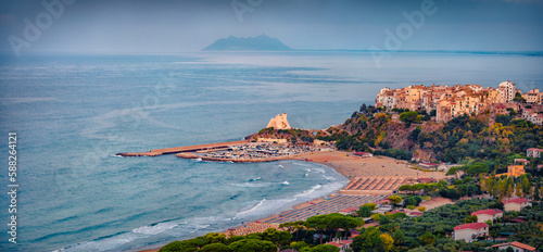 Fototapeta Naklejka Na Ścianę i Meble -  Panoramic summer cityscape of Sperlonga town with Truglia Tower. Astonishing morning seascape of Mediterranean coast of Italy, Europe. Traveling concept background.