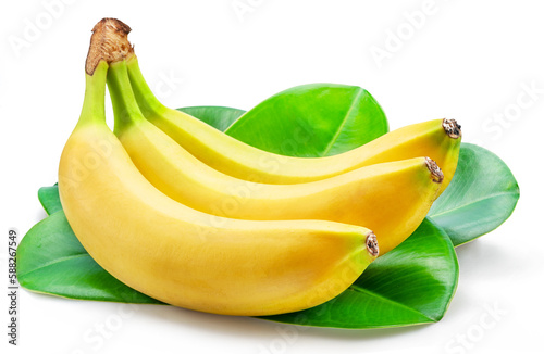 Banana bunch over green banana leaves isolated on white background.